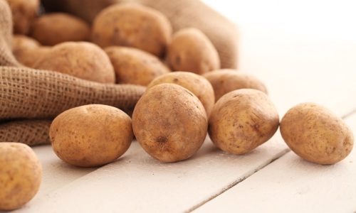 rustic-unpeeled-potatoes-table-min